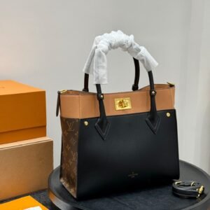 lv on my side handheld tote